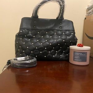 Beautiful Med Size Black Purse/HandBag with Rims stones on the front.